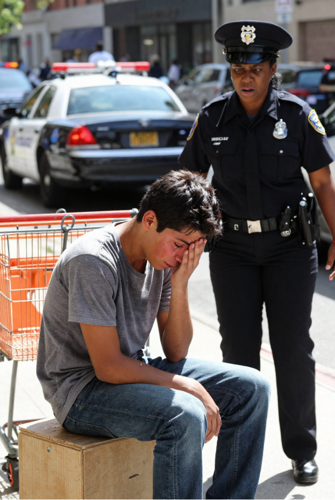 “A POLICE SERGEANT DEMANDED MY ORANGES FOR FREE. HE DIDN’T KNOW THE WOMAN WATCHING FROM ACROSS THE STREET WOULD CHANGE EVERYTHING. SOMETIMES JUSTICE WEARS A UNIFORM YOU LEAST EXPECT. WHAT HAPPENS WHEN THE ABUSER FINALLY MEETS HIS MATCH?  I LOST MY FAMILY IN AN EARTHQUAKE. NOW A COP TAKES MY ONLY INCOME. I DIDN’T KNOW MY BLOOD WAS STANDING TWENTY FEET AWAY, WATCHING HIM SLAP ME. THE MOMENT SHE STEPPED FORWARD, HIS WORLD COLLAPSED. COULD FATE BE THIS CRUEL BEFORE IT BECOMES KIND?  HE SLAPPED ME FOR ASKING TO BE PAID. I WAS JUST A KID WITH A FRUIT CART. THEN A WOMAN IN PLAIN CLOTHES WALKED OVER, AND I SAW THE SERGEANT’S FACE DRAIN OF COLOR. HE HAD NO IDEA HE’D JUST HIT THE LITTLE BROTHER OF A POLICE CAPTAIN. CAN POWER FINALLY SERVE THE WEAK?  THEY TOLD ME THE BADGE MEANT PROTECTION. THEN SERGEANT MIKE JOHNSON TOOK MY ORANGES AND MY DIGNITY. THE NEXT SLAP HE THREW ECHOED LOUDER THAN HE KNEW—BECAUSE THE CAPTAIN WATCHING WAS MY LONG-LOST SISTER. WHEN THE SYSTEM FAILS, WHO DO YOU CALL? SOMETIMES, FAMILY ANSWERS.”